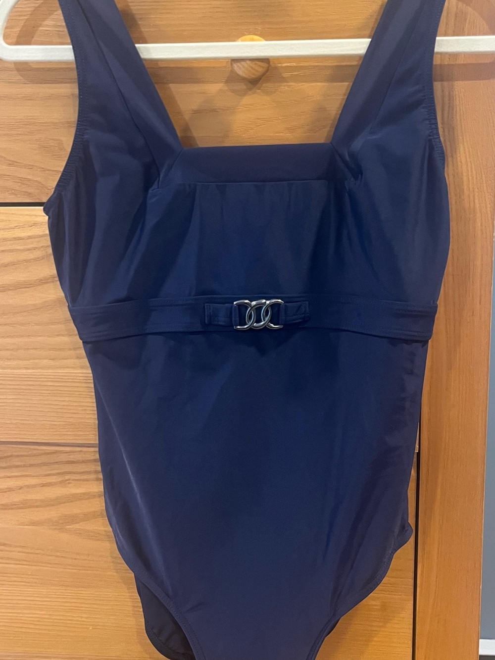 Navy One-Piece with Decorative Metal Accent
